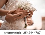 Close-up of a bouquet of white flowers in the bride