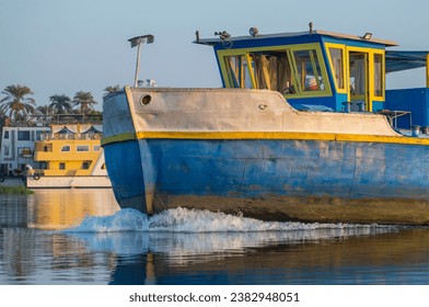 Closeup of bow on industrial river barge boat vessel traveling along large river in Africa  - Powered by Shutterstock