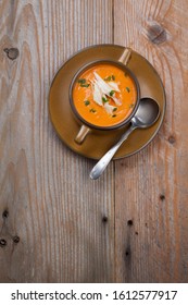 Closeup Of A Bowl Of Crab Bisque Garnished With Fresh Cooked Dungeness Crab Meat And Green Chives. Rustic Style.