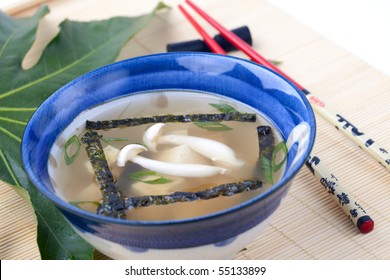 Closeup Of Bowl Of Miso Soup With Mushrooms, Seaweeds And Tofu.