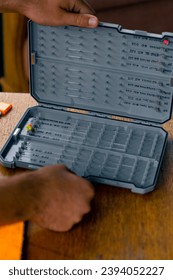 close-up of box for hooks with baits for professional sport fishing