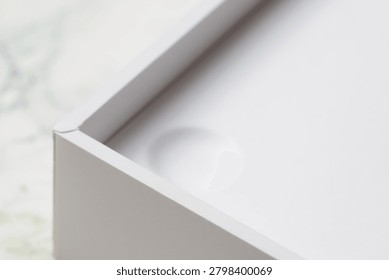Close-up of a box on a table with unknown contents.