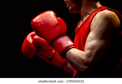 Close-up Boxer In Red Gloves On Black Background