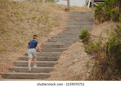 A Closeup Of A Boy Running Outside