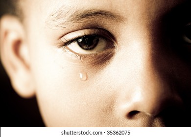 closeup of a boy's face - crying tears