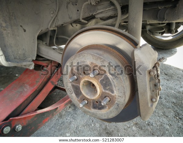 Closeup of brake disc\
mounted on car