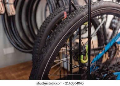 Closeup Of Brand New Tires Of Several High-end Bicycles On Display At A Bike Shop.