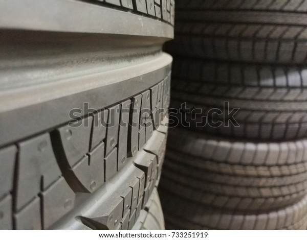 closeup of
lot of brand new tires at tire warehouse
