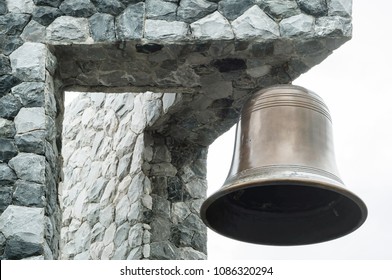 Closeup brass bell at the corner of the building - Powered by Shutterstock