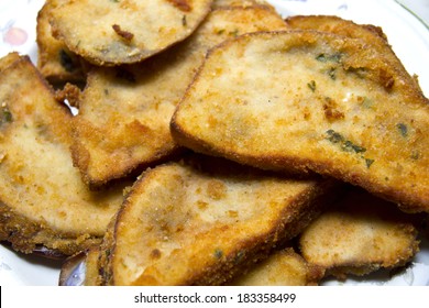 Closeup Of Breaded Eggplant On Ceramic Plate