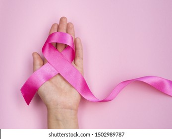 Close-up breast cancer concept with ribbon - Shutterstock ID 1502989787