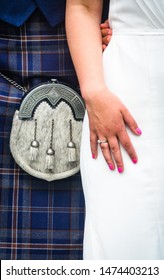 Closeup Of  Bride And Groom Wearing A Kilt At Wedding In Scotland