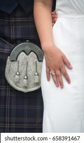 Closeup Of  Bride And Groom Wearing A Kilt At Wedding In Scotland