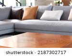 Close-up of bright living room with sofa and table in front of sofa against blurred background