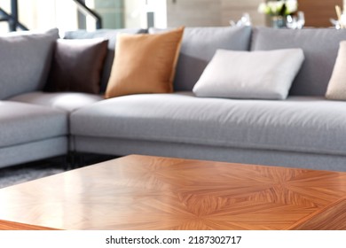Close-up of bright living room with sofa and table in front of sofa against blurred background - Shutterstock ID 2187302717
