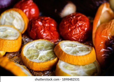 Close-up Of Bright Yellow And Red Baking Veggies Vegetables. Roasted Peppers, Zucchini, Tomato, Onion. Homemade Grill Dish. Foil On Baking Sheet. Sliced Zucchini. Selective Focus.