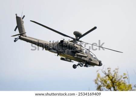 close-up of a British army Boeing Apache Attack helicopter AH2 AH64E AH-64E ArmyAir in low level flight, Wiltshire UK