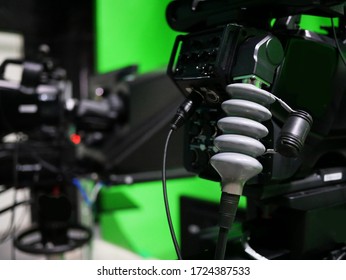 Closeup Of Broadcast Television Studio Camera With Greenscreen At TV Station.