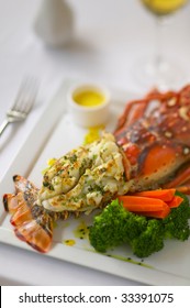 Closeup Of A Broiled Or Baked Lobster Tail With Vegetables.