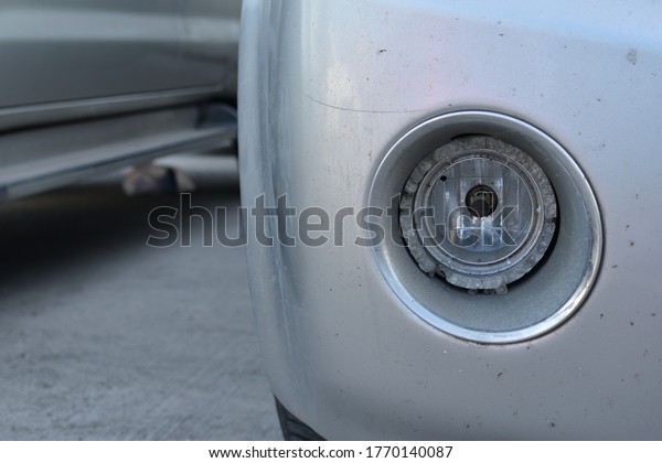 Close-up\
of the broken car headlights  And cannot be\
used