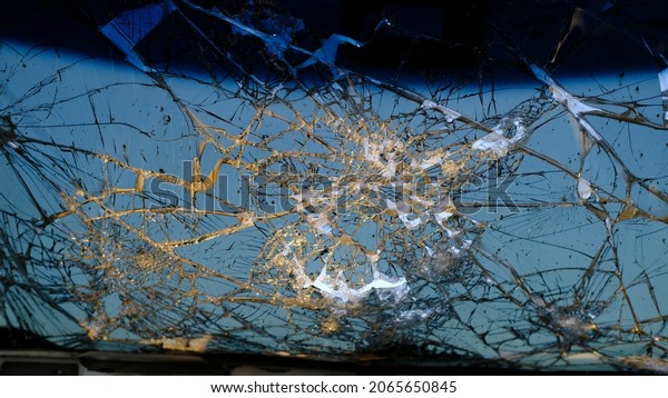 A closeup of a broken car\
window