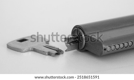 Close-up of broken key and lock with half key inside