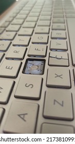 Close-up Of Broken Laptop Keyboard Keys