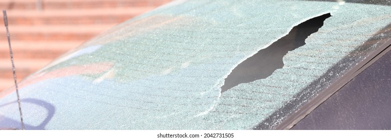 Closeup Of Broken Rear Window Of Car