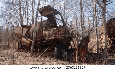 Closeup Of Broken Tractor Cabin, Windowless Frame And Rusted Controls With Peeling Paint, Birch Trunks Framing