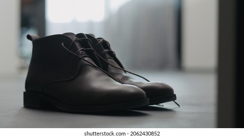 closeup brown leather chukka boots indoor