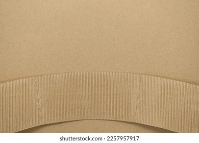closeup brown paper cardboard on brown background - Shutterstock ID 2257957917