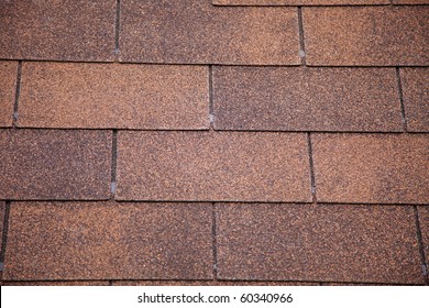 A Close-up Of Brown Toned Architectural Style Asphalt Roofing Shingles.