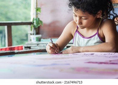 close-up of a brown-skinned latina girl, coloring her homework with a purple pencil, low-income colombian student concentrating on her drawing. concept of poverty and nature - Powered by Shutterstock