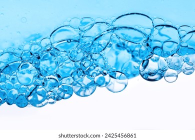 Close-up of bubbles in water, scientific background of cosmetic essence, serum under a microscope. Hydration The concept of developing cosmetics for skin care. Beauty Hydration background - Powered by Shutterstock