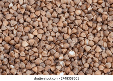 Closeup of buckwheat kernels emphasizing nutritious texture and color, Magnified view of buckwheat groats showcasing proteinpacked structure and natural warm shades