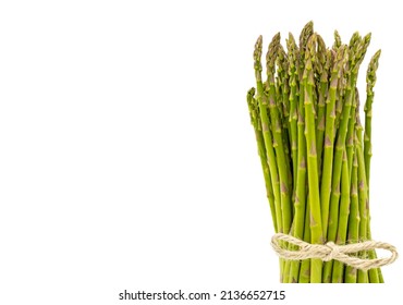 Close-up of a bunch of asparagus tied with a string, isolated on a white background 