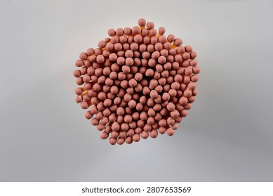 A close-up of a bundle of matches on grey background