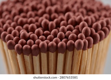 A close-up of a bundle of matches on grey background