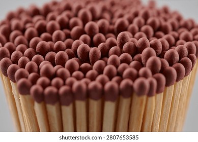 A close-up of a bundle of matches on grey background