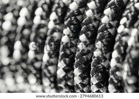 Close-up of a bundle of a white and black rope coiled