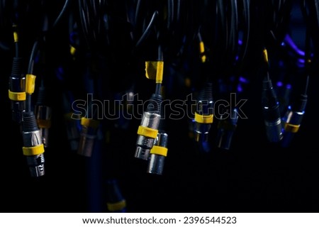 Close-up of bundles of XLR cables for connecting concert equipment.