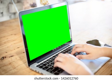 Close-up Of Business Female Working With Laptop And Smartphone In Coffee Shop Like The Background.green Scree