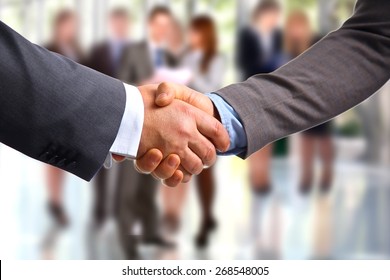 Closeup Of A Business Handshake, On White Background