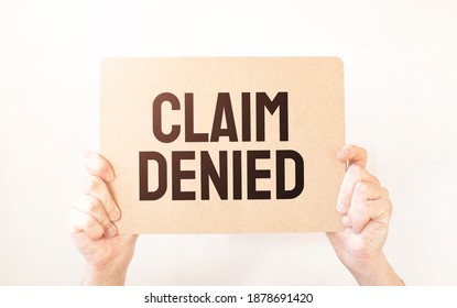 Closeup Business man hand holding show blank paper sheet mock up empty white board space for shouting text rule or protest word. Text Claim Denied - Shutterstock ID 1878691420