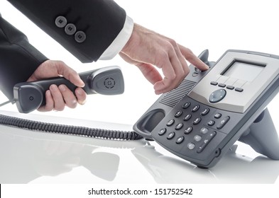 Closeup Of A Business Man Hanging Up The Phone.