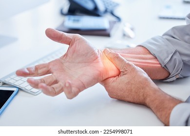 Closeup, business and man with wrist pain, while working and overworked with muscle strain, office and injury. Zoom, male employee or consultant holding hand, suffering from arthritis or inflammation - Shutterstock ID 2254998071