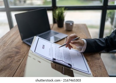 Close-up Of Business Owner Check Resume Of Job Applicants In Company At The Office.