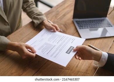 Close-up Of Business Owner Check Resume Of Job Applicants In Company At The Office.