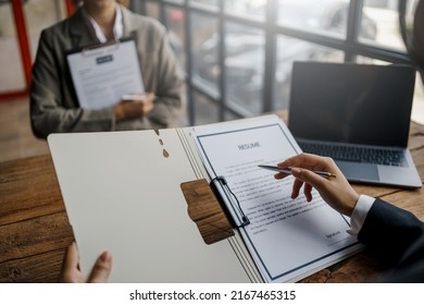 Close-up Of Business Owner Check Resume Of Job Applicants In Company At The Office.