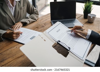 Close-up Of Business Owner Check Resume Of Job Applicants In Company At The Office.